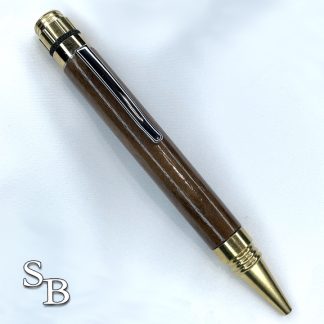 5008 Walnut Pen with Brass metal hardware that has a top that spins.